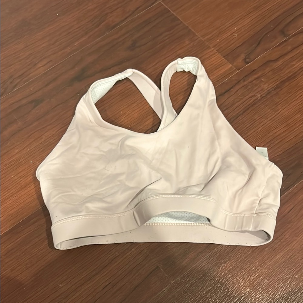 Cream Sports Bra with Racerback Design and Supportive Band